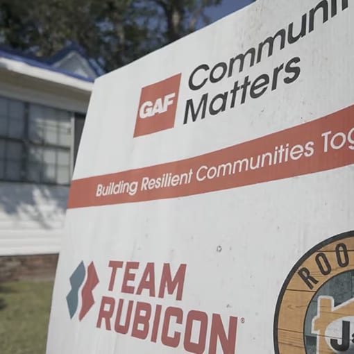 GAF Community Matters and Team Rubicon sign outside a storm-resilient residential home.