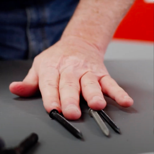 hand touching fasteners