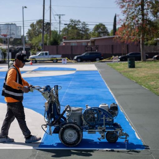 GAF helps coat public space in LA community to help combat the urban heat effect.