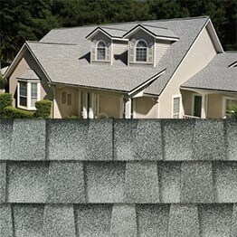 Timberline HDZ birchwood shingle closeup with sample product image on a beige house.