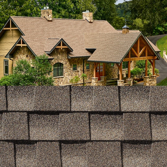 GAF Timberline HDZ® Mission Brown Shingle closeup with sample product image on a stone house.