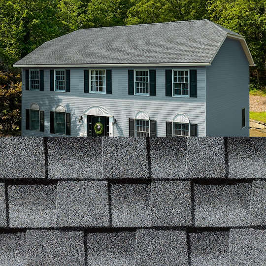GAF Timberline HDZ® Pewter Gray Shingle closeup with sample product image on a light blue house