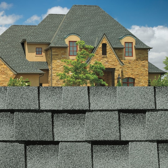 GAF Timberline HDZ® Slate Shingle closeup with sample product image on a  brick house.