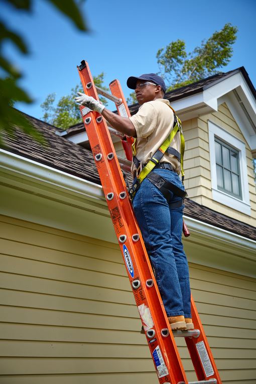 GAF certified roofer on ladder