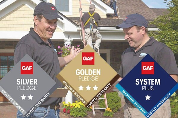 GAF team members with certified contractors showing enhanced warranty options for certified contractors.