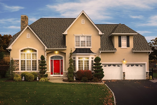 Beige home with GAF residential roofing materials
