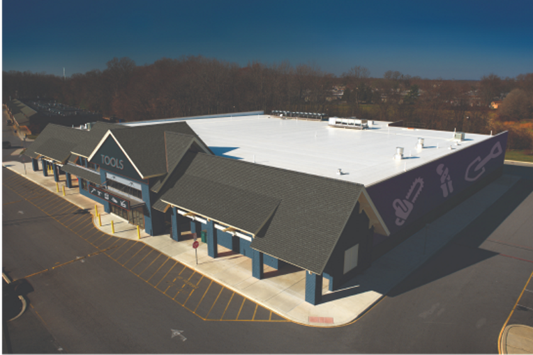 Commercial roof with by flat and sloped surfaces