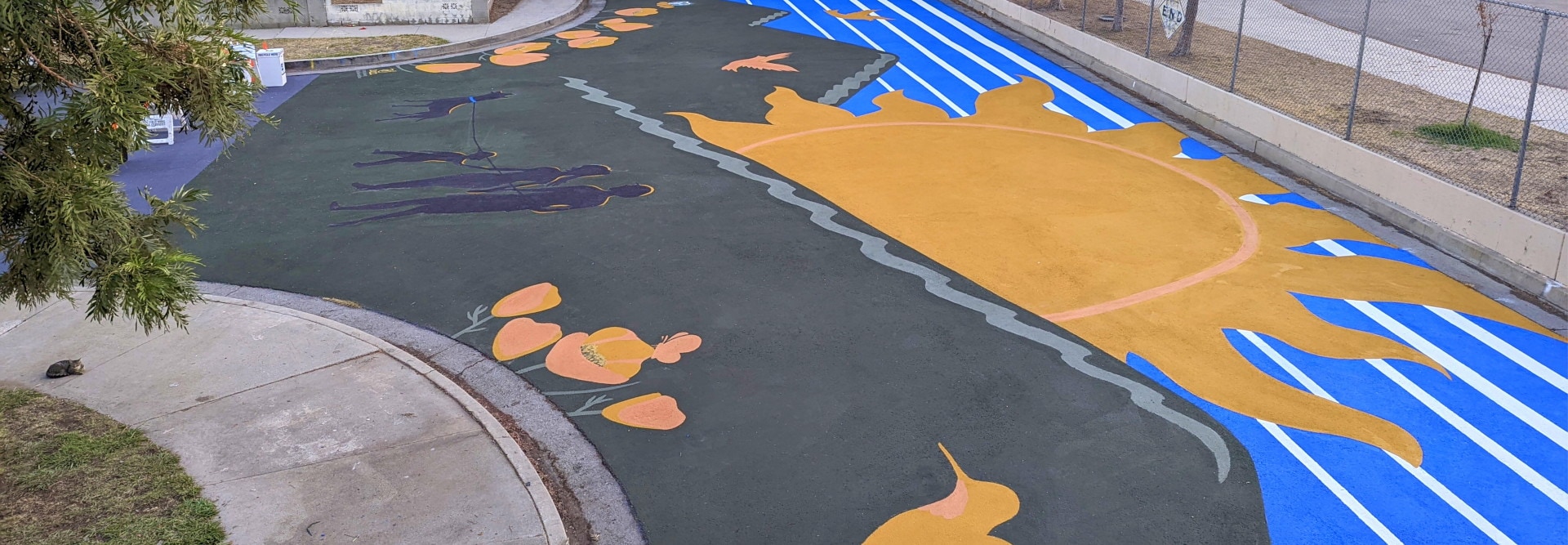 Newly designed school playground using StreetBond coating, helping cool the asphalt.