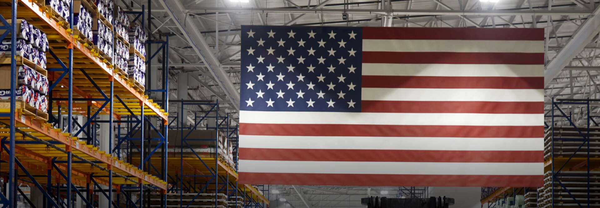 An American flag hangs inside a GAF manufacturing facility where SkillBridge trainees gain skills for civillian careers. 