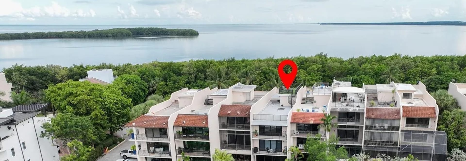 Aerial view of Paradise Point Townhomes in Palmetto Bay, FL with GAF roofing and waterproofing solutions.