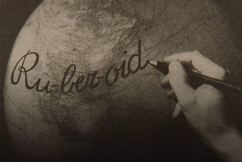 RUBEROID written in cursive on globe