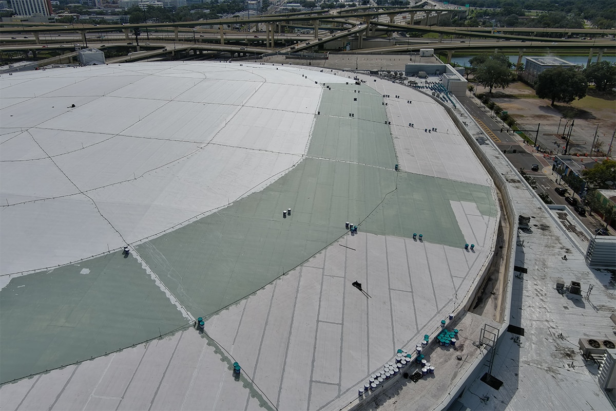 Aerial view of the roofing materials being installed on the dome roof of the Kia Center.