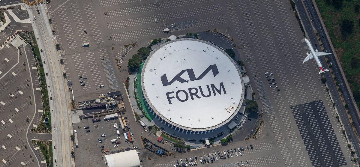 Aerial view of the Kia Forum roof with GAF commercial roof coatings and logo