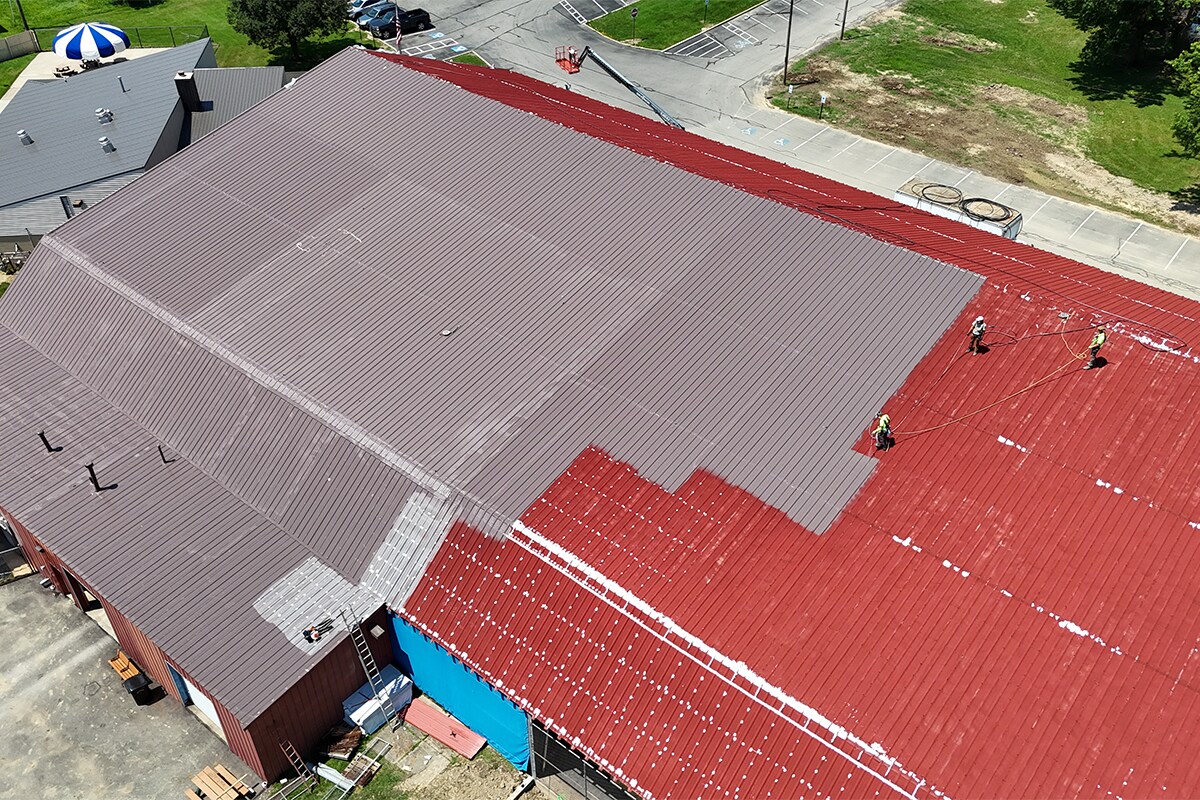 Aerial view of the Elyria Ice Rink in Ohio undergoing a liquid-applied restoration with GAF silicone coating.