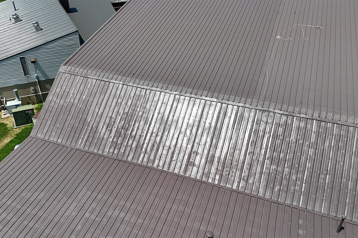 Bend in the Elyria Ice Rink arena roof restored with a silicone coating system from GAF.
