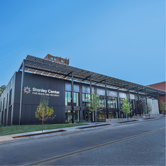 Modern exterior of the Stanley Center commercial building featuring a flat roof canopy structure.