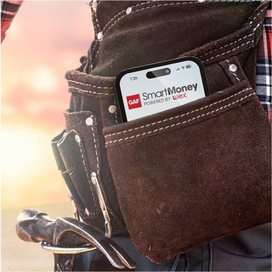 Smartphone showing GAF SmartMoney app in a leather tool belt worn by a GAF certified contractor.