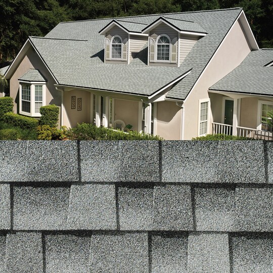 GAF Timberline HDZ® Birchwood Shingle closeup with sample product image on a beige house.