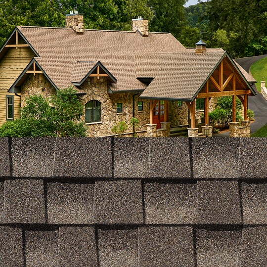 GAF Timberline HDZ® Mission Brown Shingle closeup with sample product image on a stone house.