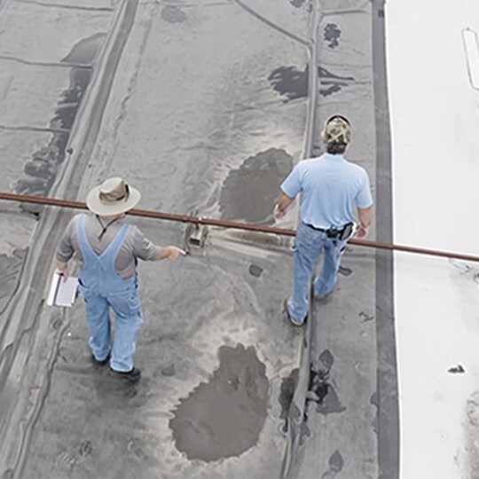 Dave and Wally perform a roof inspection