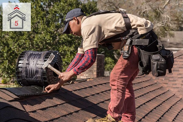 Contractor installing attic vents