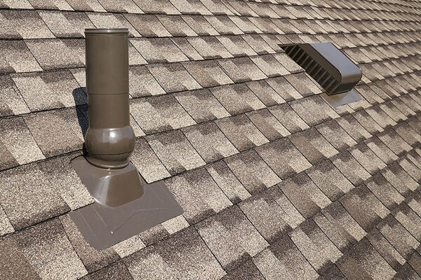Rooftop accessories manufactured by GAF on a roof, helping prodct against leaks. 