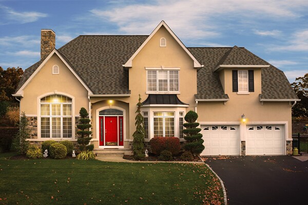 Beige home with GAF residential roofing materials