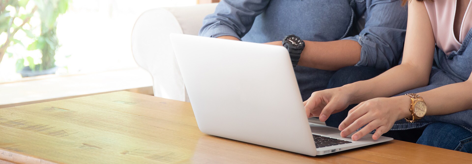 Two people on a laptop