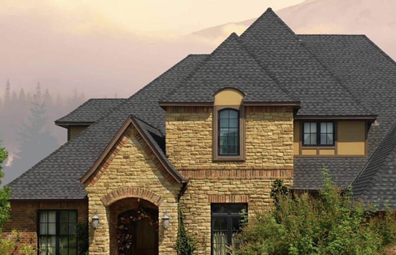 Beige brick home with grey GAF Timberline HD Reflector Series shingles