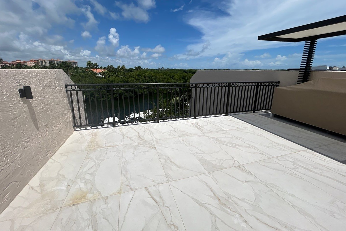 A front view of a rooftop deck with railing at Paradise Point Townhomes.