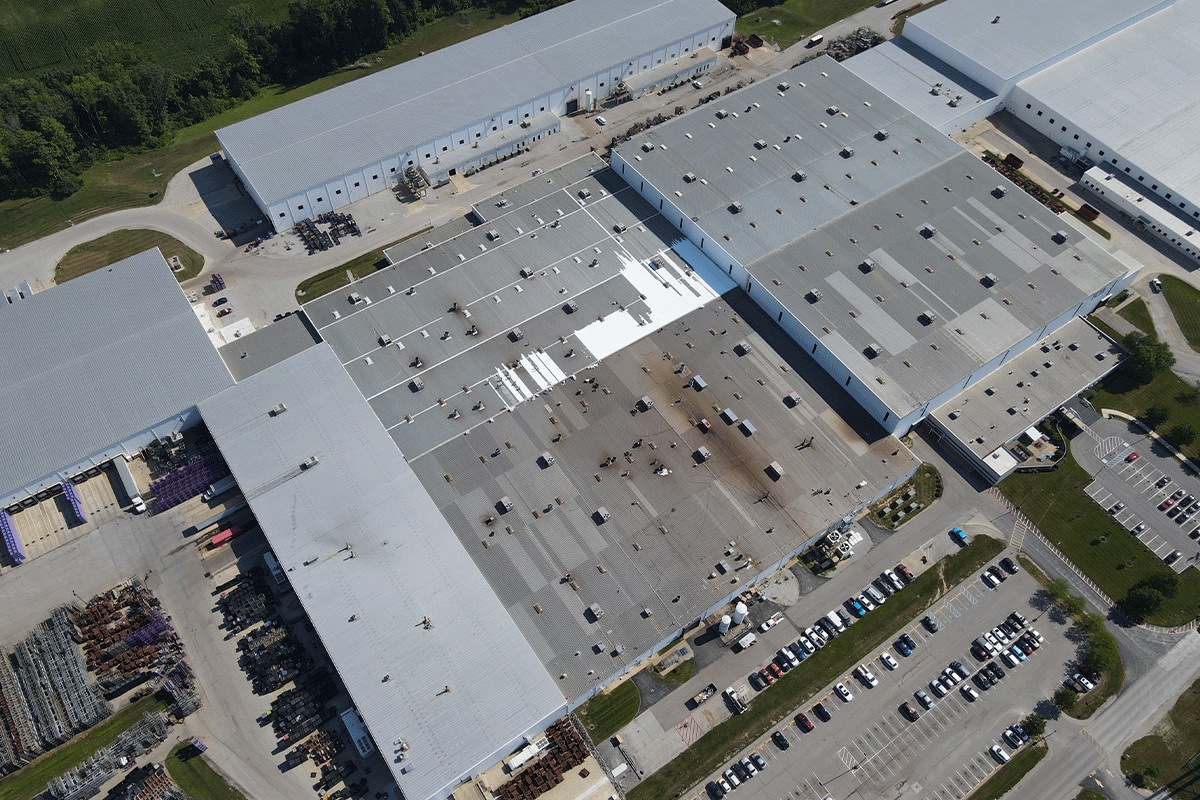 Aerial view of the TOA USA metal roof before being restored with a GAF silicone coating.