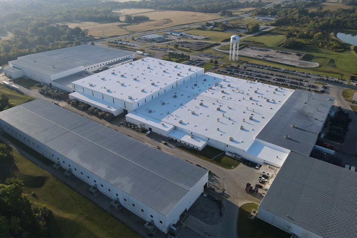 Top view of the TOA USA facility in IN with new silicone roof restored by GAF roof coating materials.