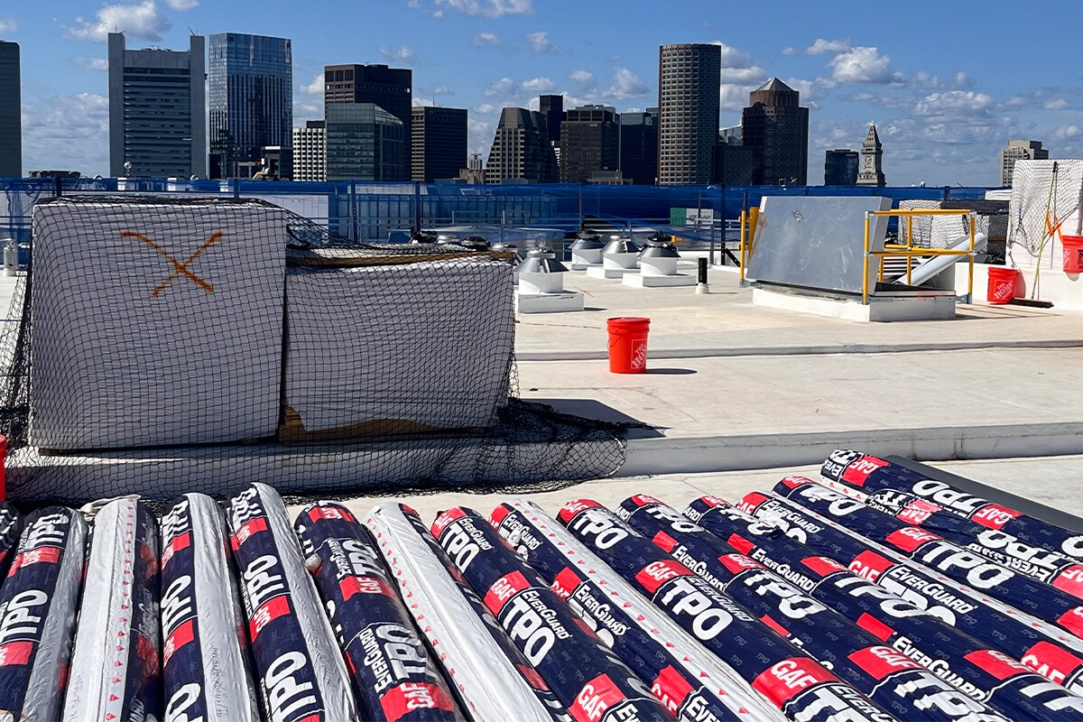 Roof staging with the Boston skyline in the background