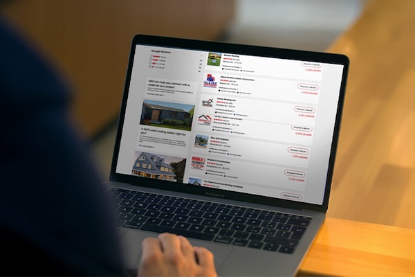 A homeowner browsing a directory page of roofing contractors 